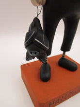 Halloween folk art pumpkin man dressed as a bat