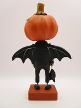 Halloween folk art pumpkin man dressed as a bat