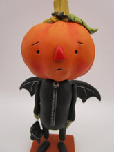 Halloween folk art pumpkin man dressed as a bat