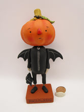 Halloween folk art pumpkin man dressed as a bat