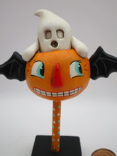 Halloween vintage style flying pumpkin with ghost rider