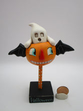 Halloween vintage style flying pumpkin with ghost rider