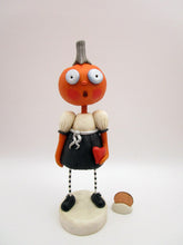 Halloween folk art pumpkin girl holding heart