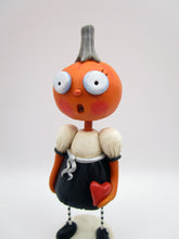 Halloween folk art pumpkin girl holding heart