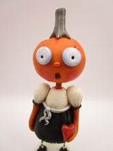 Halloween folk art pumpkin girl holding heart