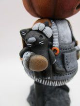 Halloween folk art pumpkin witch with black cat