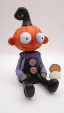 Halloween Pumpkin sitter with zig zag mouth and swirl ears