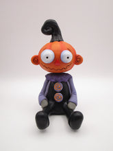 Halloween Pumpkin sitter with zig zag mouth and swirl ears