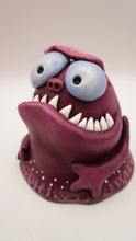 Monster purple blob with spiked teeth and hands