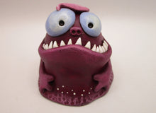 Monster purple blob with spiked teeth and hands