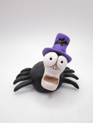 Halloween spider with skelly style head and purple hat