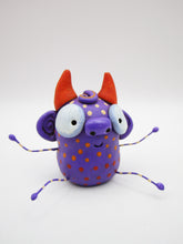 Monster folk art little purple spotted monster with bendable arms and legs