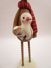 Christmas folk art reindeer with wood legs holding snowman