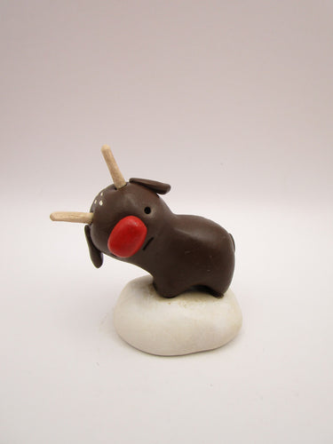 Christmas folk art brown reindeer standing with wood antlers
