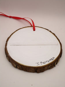 Christmas folk art ornament featuring reindeer on wood slice round