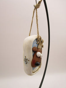 Christmas folk art ornament with reindeer character