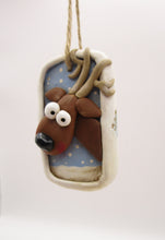 Christmas folk art ornament with reindeer character