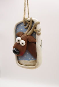 Christmas folk art ornament with reindeer character