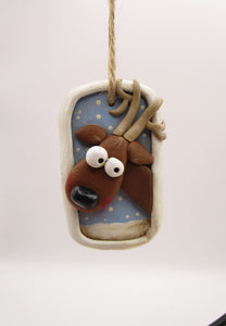 Christmas folk art ornament with reindeer character