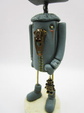 Robot character with metal robot charm