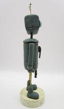 Robot character with metal robot charm
