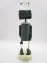 Robot character with metal robot charm