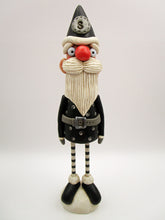 Christmas folk art Santa in black with wood legs - fabulous!