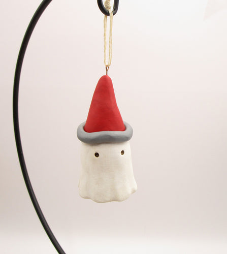Christmas folk art ghost ornament with Santa hat