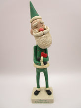 Christmas folk art Santa embracing a red heart