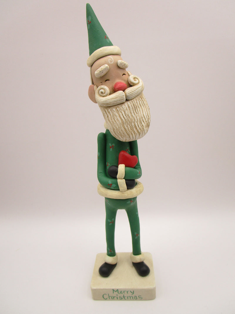 Christmas folk art Santa embracing a red heart