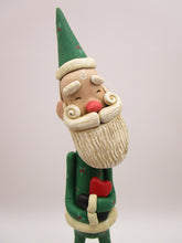 Christmas folk art Santa embracing a red heart