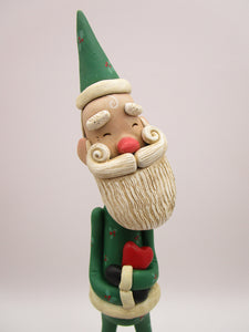 Christmas folk art Santa embracing a red heart