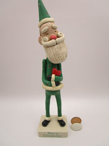 Christmas folk art Santa embracing a red heart