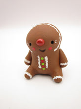 Christmas folk art small sitting Gingerbread man in honey brown