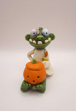 Halloween folk art sitting zombie with removable pumpkin