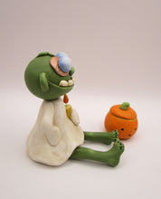 Halloween folk art sitting zombie with removable pumpkin
