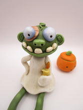 Halloween folk art sitting zombie with removable pumpkin