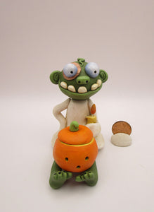 Halloween folk art sitting zombie with removable pumpkin