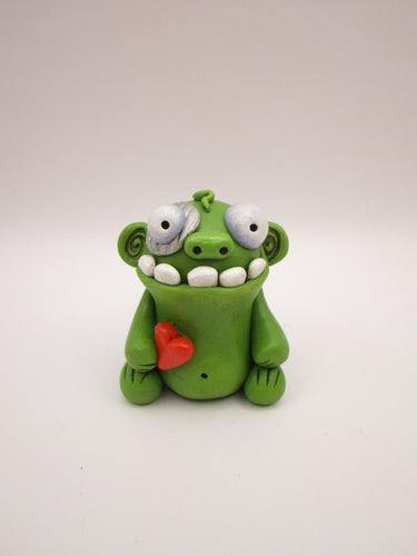 Halloween or anytime chubby sitting zombie with heart