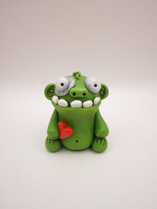 Halloween or anytime chubby sitting zombie with heart