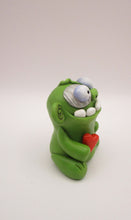 Halloween or anytime chubby sitting zombie with heart