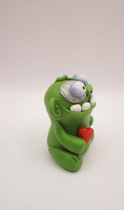 Halloween or anytime chubby sitting zombie with heart