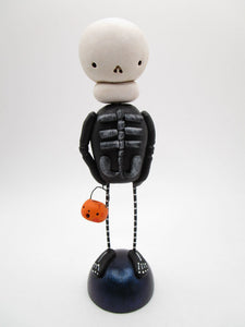Halloween folk art skeleton man with tiny JOL bucket