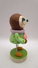 Easter folk art sloth girl in carrot dress