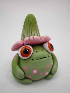 Spring folk art frog wearing pink flower hat with stem 1.75 tall