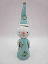 Christmas folk art snowman with snowflake like pattern