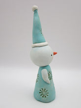 Christmas folk art snowman with snowflake like pattern