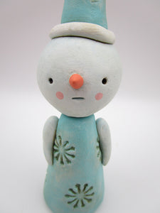 Christmas folk art snowman with snowflake like pattern