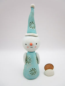 Christmas folk art snowman with snowflake like pattern