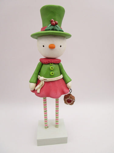 Christmas folk art snowman snow girl with fancy hat and jam sugar cookie
